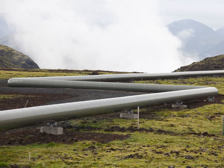 Steel pipeline on a foggy mountain Steel pipeline on a foggy mountain